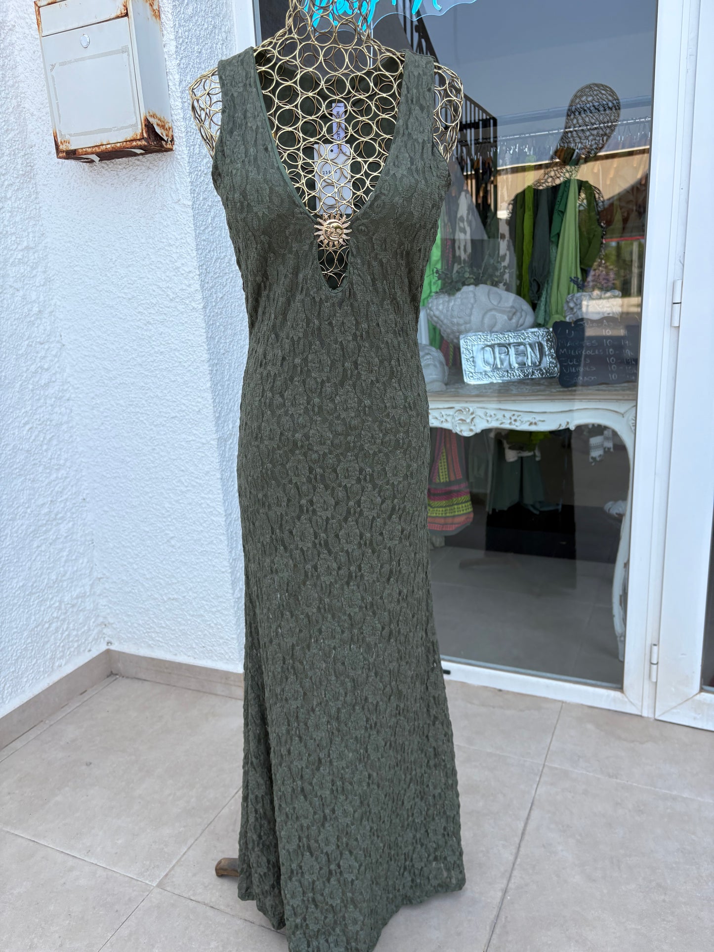 Lace dress with sun brooch