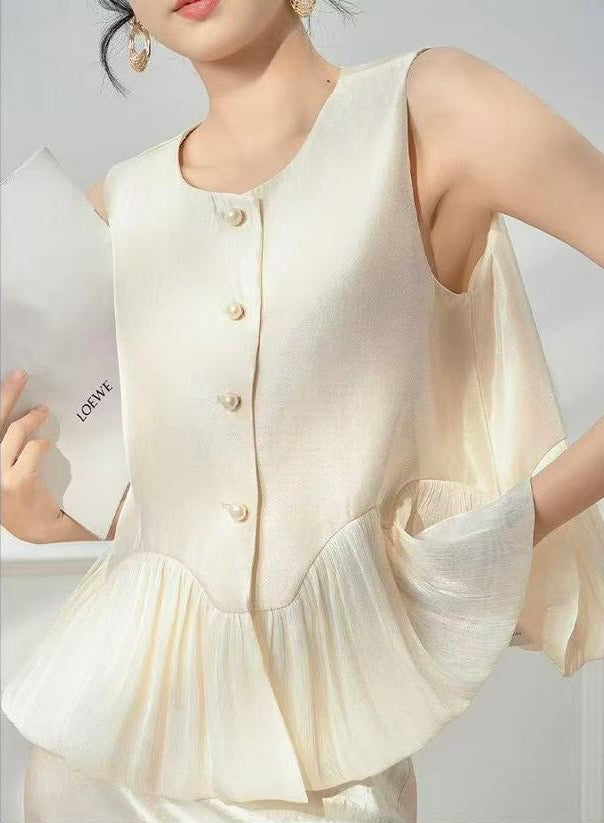 Peplum and pearl waistcoat
