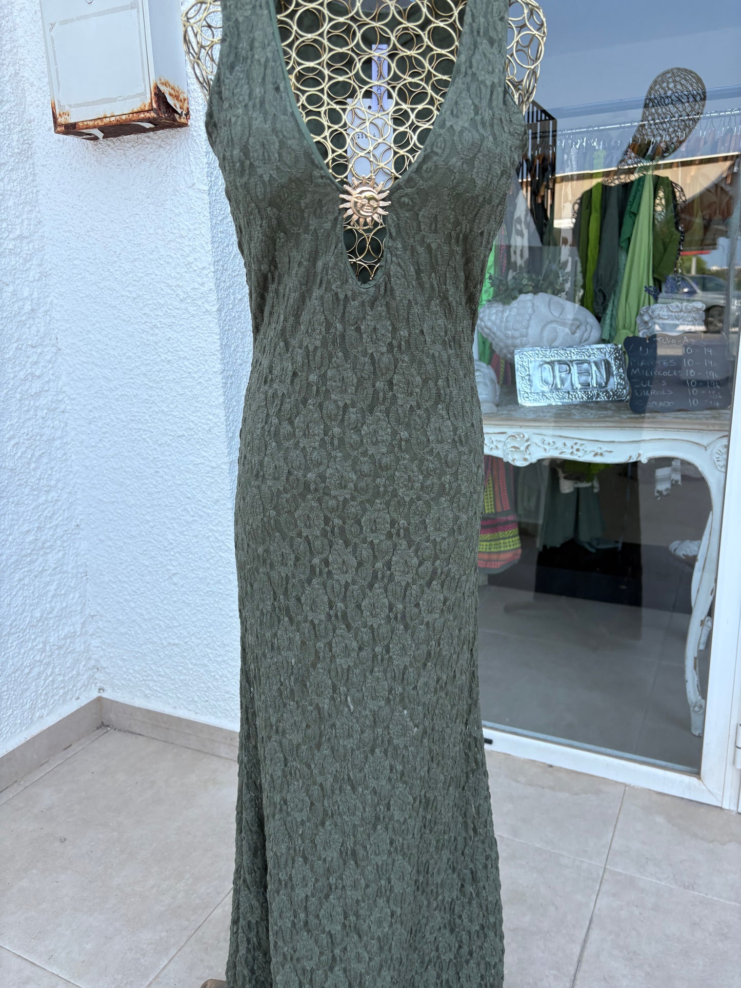 Lace dress with sun brooch