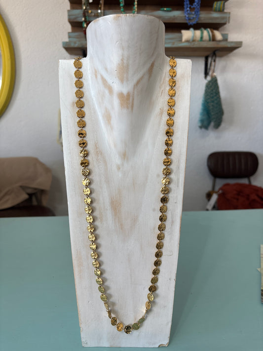 Gold coloured long disc necklace