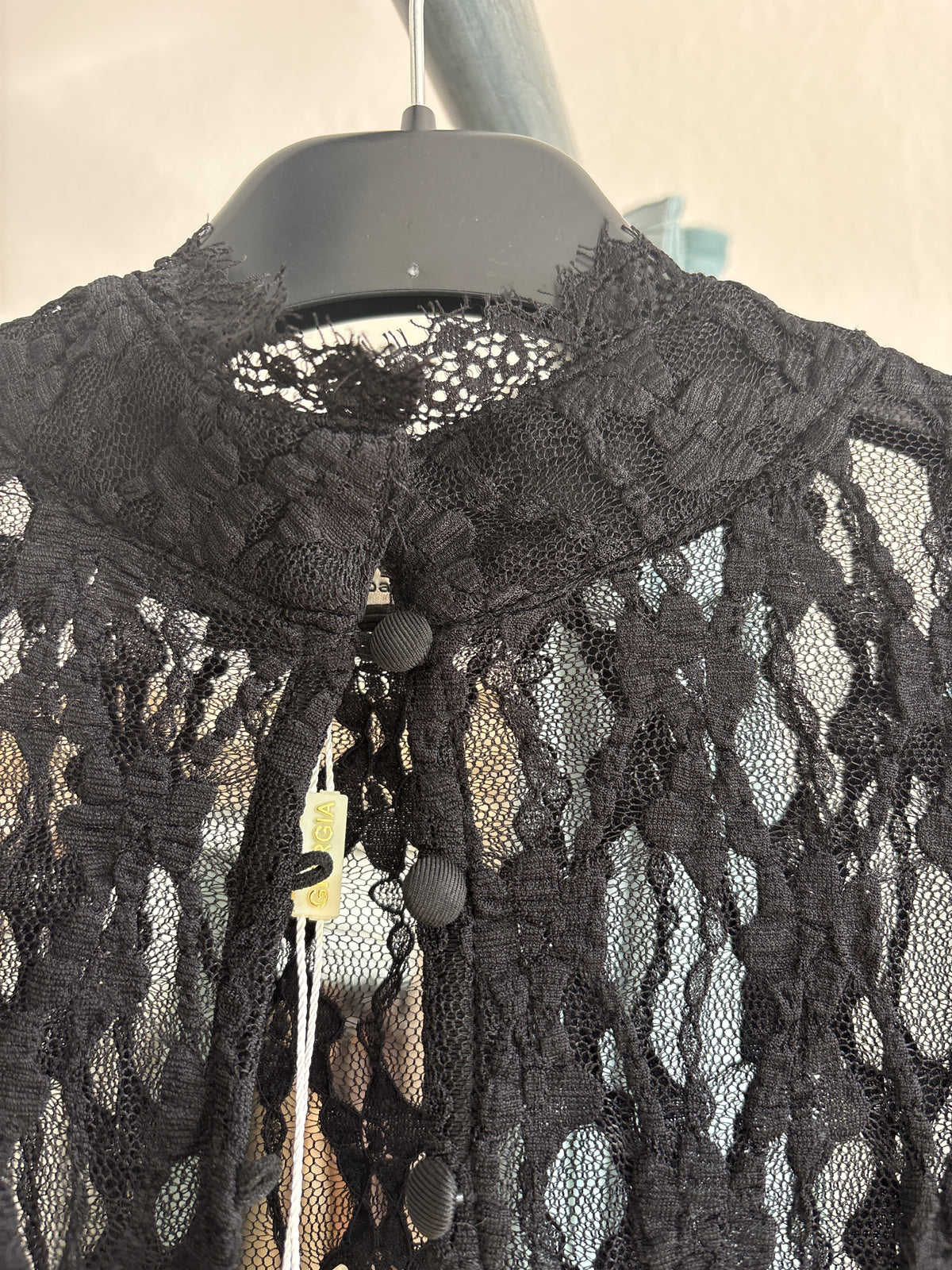 Assymetrical lace overlay top